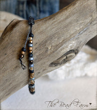 Load image into Gallery viewer, Adjustable Boho Hippie Seed Bead Bracelet in denim blue, gold, and black
