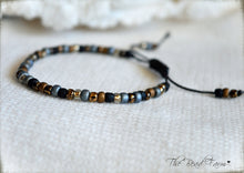 Load image into Gallery viewer, Adjustable Boho Hippie Seed Bead Bracelet in denim blue, gold, and black
